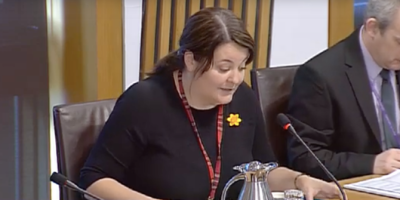 Ruth Maguire MSP speaking in a Committee room at the Scottish Parliament